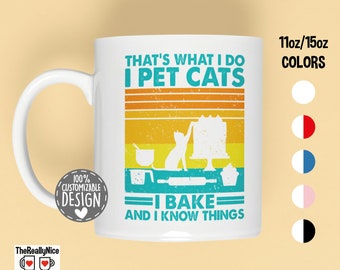 May include: White ceramic mug with a retro-style design featuring a cat and baking tools. The text reads "That's what I do I pet cats I bake and I know things".