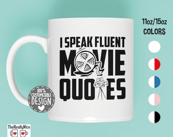 May include: White ceramic mug with a black design that says "I speak fluent movie quotes". The design includes a film reel and a movie camera. The mug is 11oz or 15oz and is customizable.