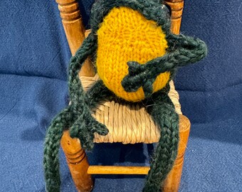 Hand spun and  hand knitted pocket dark green frog with bright yellow tummy