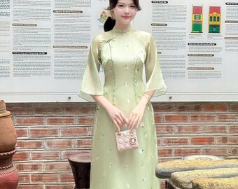 Green Vietnamese traditional Ao Dai long dress with 3D