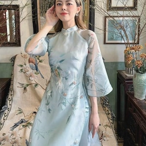 Elegant Light Blue Vietnamese Ao Dai with Sheer Sleeves and Hand-Embroidered Floral Design | Ao Dai With Blue Pants | Áo Dài Cách Tân
