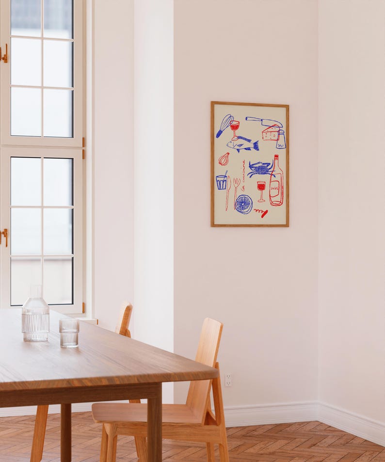 May include: A framed illustration of a variety of food and drink items, including a fish, a crab, a bottle of wine, a glass of wine, a lemon, a knife, a fork, a whisk, a cheese wedge, and a corkscrew. The illustration is in blue and red on a cream background.