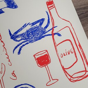 May include: A hand-drawn illustration of a wine bottle, a glass of wine, a corkscrew, a crab, a lemon, and a salt shaker. The illustration is done in red and blue ink on a white background. The wine bottle is labeled "Olive". The salt shaker is labeled "Salt".
