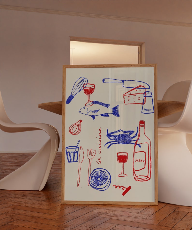 May include: A framed illustration of a kitchen scene with red and blue drawings of food, wine, and kitchen utensils. The text "la cucina" is written in blue on the white background.