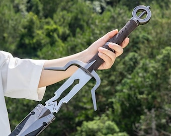 May include: A silver-colored metal sword featuring a complex, cut-out blade design with two prominent, outward-curving crossguards. The handle is wrapped in dark brown cord and terminates in a circular pommel with a central horizontal bar.