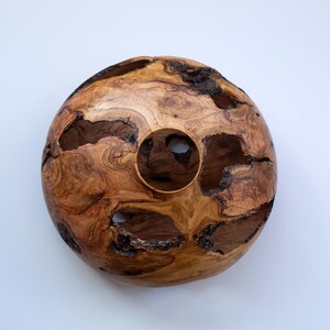 Rustic wood vase with bark pockets and rich grain, artisan made on a lathe.
