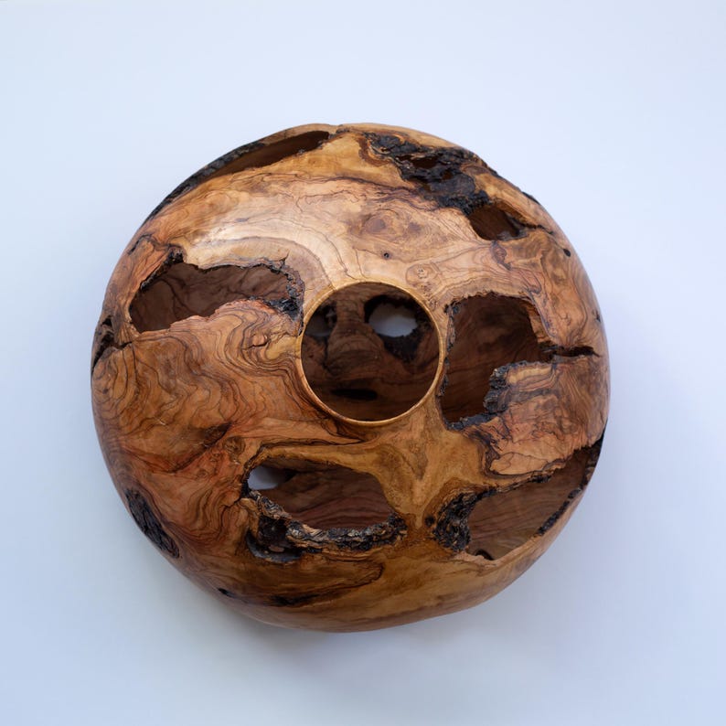 Rustic wood vase with bark pockets and rich grain, artisan made on a lathe.
