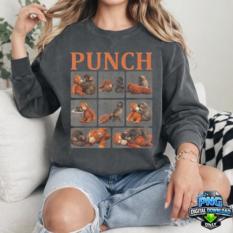 May include: Dark gray sweatshirt with the word "PUNCH" in orange block letters. The sweatshirt features a grid of nine squares, each with a different illustration of cartoon animals. The overall theme is playful and whimsical.