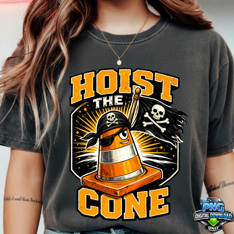 May include: Dark grey t-shirt featuring a cartoon traffic cone pirate with the text "HOIST THE CONE". The cone wears an eye patch and bandana, holding a skull and crossbones flag. The design is in orange and black.