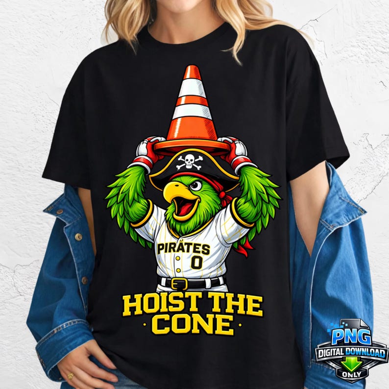 May include: Black t-shirt featuring a cartoon parrot wearing a pirate hat and holding a traffic cone. The parrot is wearing a baseball jersey with the word "Pirates" and the number "0". The text "HOIST THE CONE" is below the parrot.