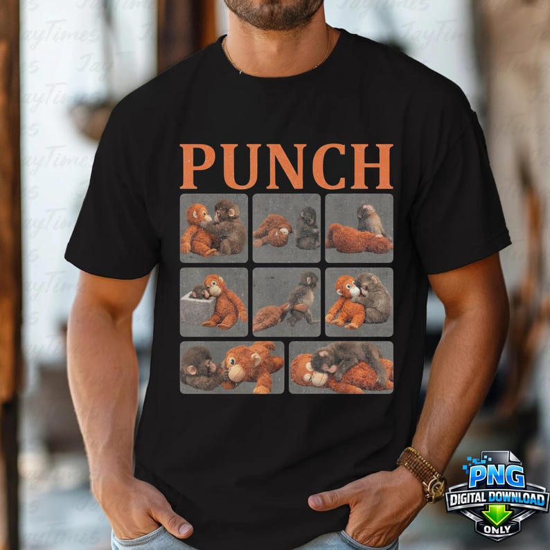 May include: Black t-shirt with the word "PUNCH" in orange block letters above a grid of nine images of orangutans. The orangutans are in various poses, some hugging and some alone. The shirt is made of a soft material.
