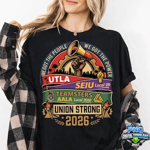 May include: Black t-shirt with a graphic design featuring a megaphone held by a fist, the text "WE GOT THE PEOPLE, WE GOT THE POWER", and union logos. The shirt also displays "UNION STRONG 2026".