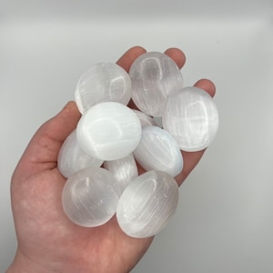 Selenite polished palm stone