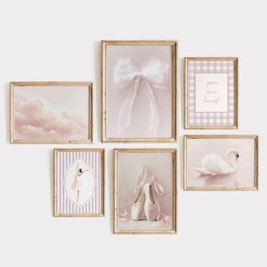 May include: A set of six framed art prints with a ballet theme. The prints feature images of a cloudscape, a bow, a swan, ballet shoes, a ballerina, and the text "you are loved". The frames are gold-colored.