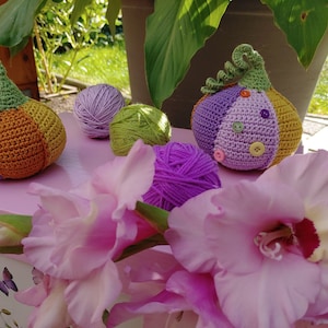 Colorful crocheted pumpkins for autumn table decorations