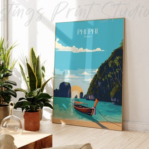 May include: A vintage travel poster with a blue and green colour scheme depicting a longtail boat in the turquoise waters of Phi Phi Island, Thailand. The poster has the text "PHI PHI Thailand" at the top.