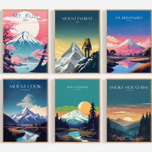 May include: A set of six vintage-style travel posters featuring iconic mountains from around the world. Each poster features a colorful illustration of the mountain, with text that includes the mountain's name and location. The posters are framed in wood and have a white background.