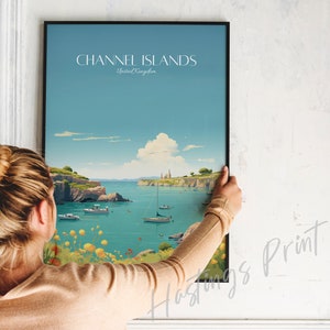 May include: A framed poster with a vintage travel illustration of the Channel Islands, United Kingdom. The poster features a blue sky, a body of water, and a small island with buildings in the distance. The text "CHANNEL ISLANDS" and "United Kingdom" is printed on the poster.