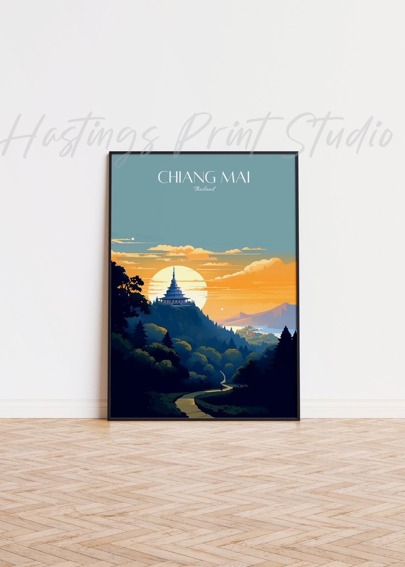 May include: A vintage travel poster with a black frame featuring a sunset scene of a temple on a hill in Chiang Mai, Thailand. The poster has the text "CHIANG MAI, Thailand" at the top.