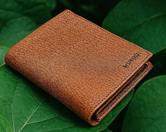 Cartera RFID plegable de cuero para hombre: capacidad extra y tarjetero extraíble.