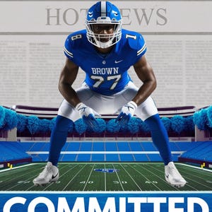 May include: A football player in a blue jersey with the name "BROWN" and the number "77" on the back, kneeling on a green field with a blue stadium in the background. The text "COMMITTED" and "University of North Carolina" is at the bottom of the image.