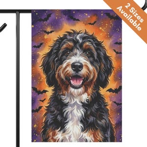 May include: A rectangular garden flag featuring a portrait of a black, brown, and white Bernese Mountain Dog mix with a fluffy coat. The background displays a vibrant orange and purple watercolor sky filled with silhouettes of flying black bats.
