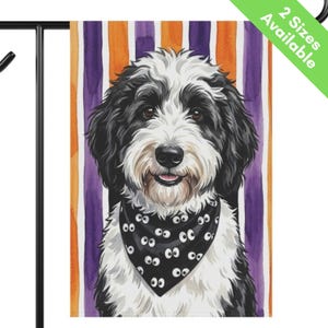 May include: A garden flag featuring a black and white dog wearing a black bandana with a white eye pattern. The background consists of vertical orange and purple stripes. The top right corner contains a green diagonal banner with the text 2 Sizes Available.