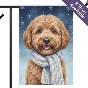 May include: A rectangular garden flag featuring a golden-brown doodle dog with a fluffy coat wearing a thick, light gray knitted scarf. The background is a dark blue gradient with white snowflake illustrations and the text 2 Sizes Available.