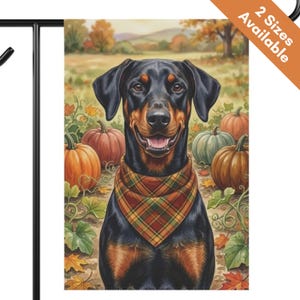 May include: A garden flag featuring a black and tan Doberman dog wearing a plaid bandana, positioned in a pumpkin patch with orange and green pumpkins, autumn leaves, and a field background. The top corner includes text stating 2 Sizes Available.