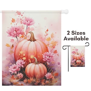 May include: A decorative garden flag featuring a watercolor painting of two pumpkins surrounded by pink flowers and autumn foliage. The pumpkins are a soft orange color, and the flowers are a vibrant pink. The text "2 Sizes Available" is visible.