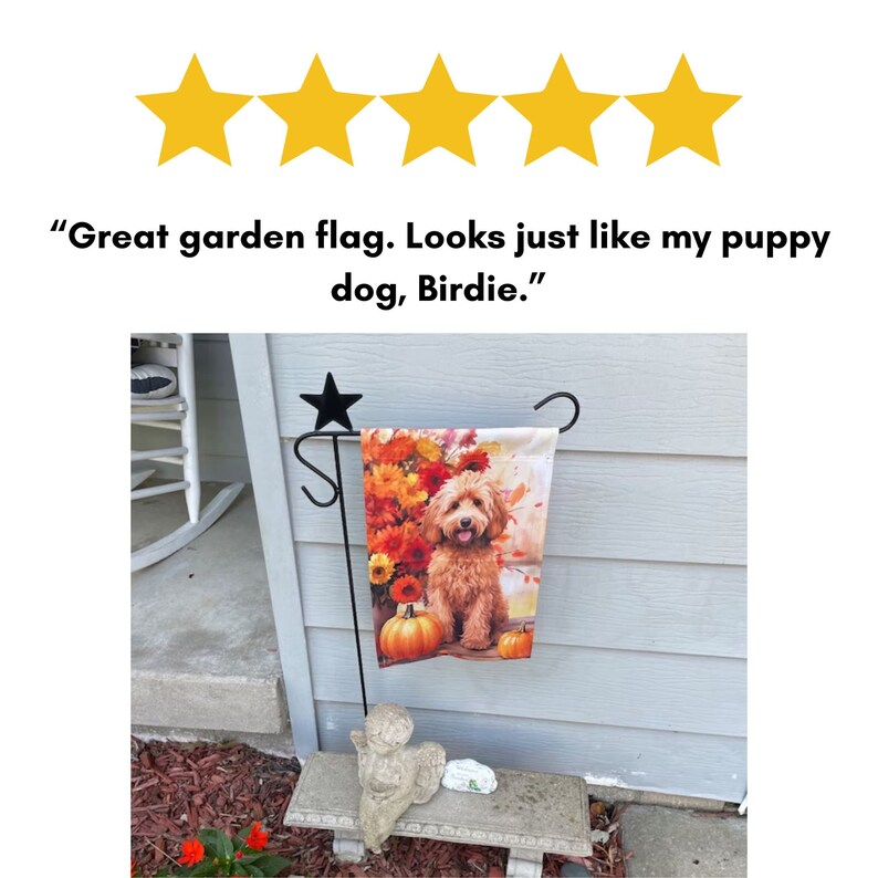May include: A garden flag with a brown and white dog on it. The dog is surrounded by fall-colored flowers and leaves. The flag is attached to a black metal stand with a star on top. The text on the flag reads "Great garden flag. Looks just like my puppy dog, Birdie."