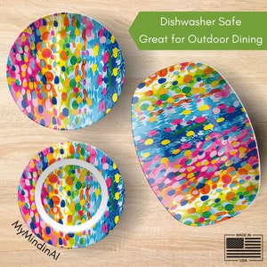 May include: A set of three colorful ceramic bowls with a bright, abstract pattern of dots and swirls. The bowls are dishwasher safe and great for outdoor dining. Made in the USA.