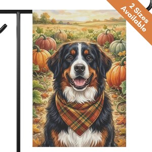 May include: A rectangular garden flag featuring a Bernese Mountain Dog wearing a plaid bandana, centered in a pumpkin patch with orange and green pumpkins, autumn leaves, and a rural landscape background. The text 2 Sizes Available is visible.