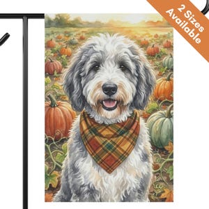 May include: A rectangular garden flag featuring a watercolor illustration of a fluffy gray and white dog wearing a plaid bandana. The dog is centered in a pumpkin patch with orange and green pumpkins under a soft sunset sky. Text reads 2 Sizes Available.