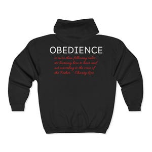 May include: Black hooded sweatshirt featuring the word "OBEDIENCE" in white capital letters. Underneath, a quote in red script states, "is more than following rules... it's learning how to hear and act according to the voice of the Father - Charity Love."