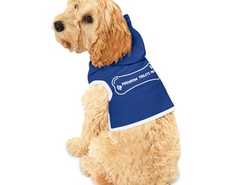 May include: A light brown dog wearing a blue hoodie with white trim. The hoodie features a bone-shaped graphic with the text "PREMIUM TREATS ONLY" in white. The dog is sitting and looking to the side.