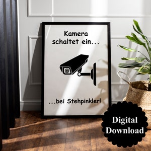 May include: Black and white printable sign with a security camera graphic and the text "Kamera schaltet ein... ...bei Stehpinkler!"  Digital Download.