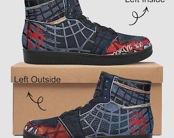 May include: High-top sneakers with a black sole and a blue, red, and gray design. The sneakers feature a spiderweb pattern, a red spider emblem, and the text "Brooklyn Kid". The shoes are displayed on a cardboard box.