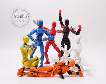 Op de afbeelding: Een verzameling beweegbare actiefiguren in verschillende kleuren, waaronder blauw, rood, geel, zwart, wit en oranje. De figuren zijn in dynamische posities geplaatst, wat beweging suggereert. De tekst "Steph's Magical Menagerie" is inbegrepen.
