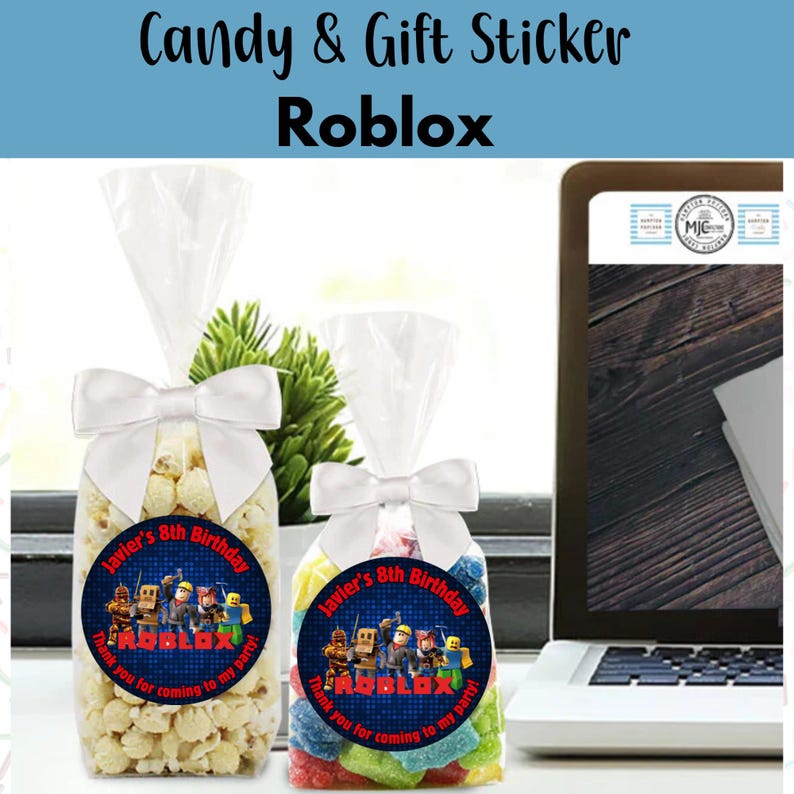 May include: Two clear cellophane bags tied with white bows, filled with popcorn and colorful candies. Each bag has a round sticker that reads "Javier's 8th Birthday" and features Roblox characters. The text "Thank you for coming to my party!" is also included.