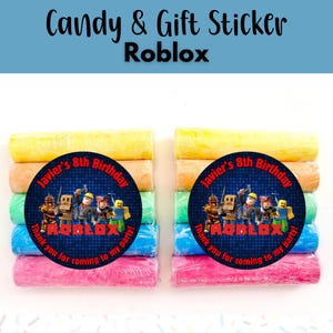 May include: Candy and gift stickers with a Roblox theme. Each sticker is round with a blue background and features Roblox characters and the text "Javier's 8th Birthday". The stickers are placed on top of colorful candy rolls.