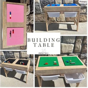 May include: A wooden building table featuring interchangeable top panels in pink, blue, black, and green, designed for construction blocks. The table includes two white storage bins attached underneath and displays the text BUILDING TABLE.