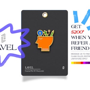 May include: A black card with a gold enamel pin featuring a head with a light bulb, pencil, ruler, and other tools inside. The card says "LAVEL Enamel Pin W/ Diamonds" and "GET $200* WHEN YOU REFER A FRIEND".