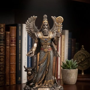May include: A detailed statue of Anu, a deity, with large wings, a long beard, and a staff. The statue is in shades of gold, blue, and bronze, with a bull at its feet. The word "ANU" is inscribed on the base. The statue is displayed on a wooden surface.