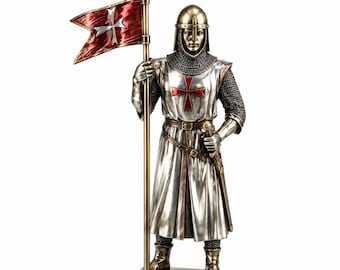 May include: A standing knight figurine wearing a metallic helmet and chainmail armor under a silver tunic with a red cross emblem. The knight holds a tall pole with a red flag featuring a silver cross, and a sword is sheathed at the waist.