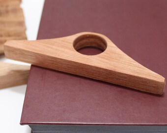 Mahogony Thumb Page Holder - Beautiful handcrafted from fine mahogany wood.   The thumb opening is 1" in diameter and fits most people.
