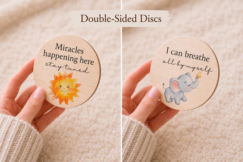 May include: Two wooden discs with inspirational quotes and illustrations. One disc features a smiling sun and the text "Miracles happening here stay tuned." The other shows a gray elephant and the text "I can breathe all by myself."