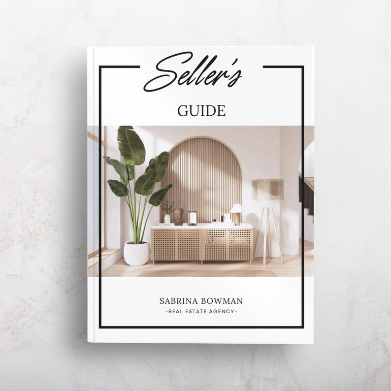 May include: A white book cover titled Seller's GUIDE by SABRINA BOWMAN -REAL ESTATE AGENCY-. The cover features a central photograph of a room with a wooden slatted arched wall, a cane-front sideboard, a tall potted plant, and a tripod floor lamp.