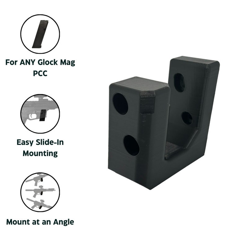 May include: Black plastic wall mount for a Glock magazine. The mount has two holes on the side and one on the back for mounting. The mount is designed to hold the magazine at an angle.