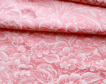 May include: Pink fabric with a white floral pattern. The fabric is folded in half, showing the pattern on both sides.
